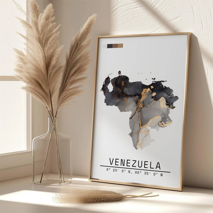 Scenic map poster displaying the country silhouette of Venezuela in a luxurious fluid ink and metallic gold color palette. Handpicked for the MapYourDreams catalog, this artwork is available in flexible styles including unframed paper prints, wooden frames, or gallery canvas.