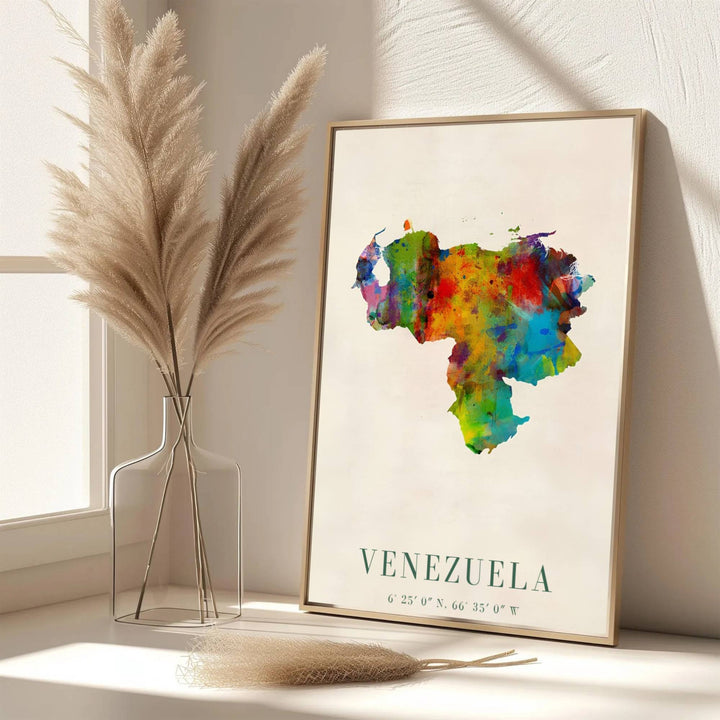 Modern abstract travel art print capturing the creative watercolor washes, paint droplets, and national geographic outline of Venezuela. Offered by MapYourDreams, customers can choose between standalone paper prints, ready-to-hang wooden frames, and gallery canvas wraps.
