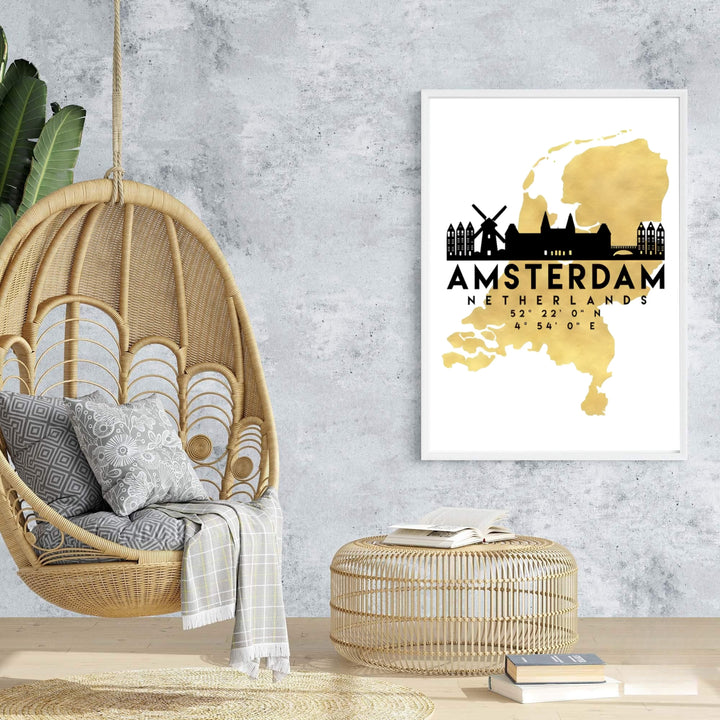 Sleek urban silhouette poster of the Netherlands map in gold with black Amsterdam windmills and canal houses, offered at MapYourDreams with choices for unframed paper, gallery-quality stretched canvas, or custom frame finishes for contemporary home interiors.