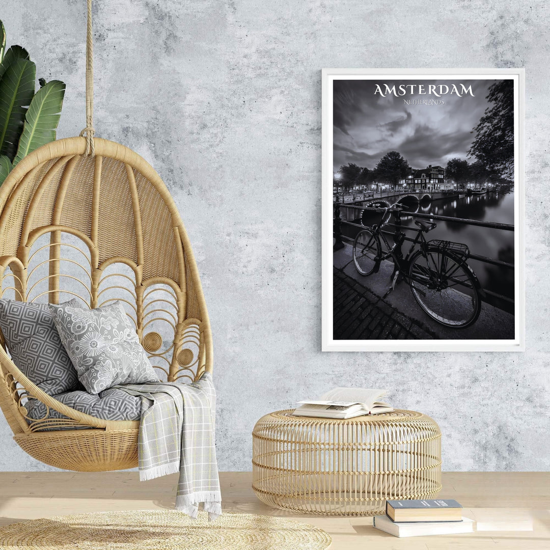 Atmospheric black and white city poster of Amsterdam architecture and peaceful canal side bridge lighting, offered at MapYourDreams with options for unframed paper prints, gallery-quality stretched canvas, or custom frame finishes for sleek, modern home interior arrangements.