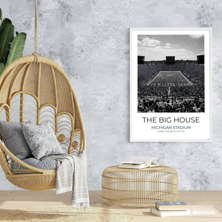 Travel poster of Ann Arbor Michigan featuring The Big House in black and white under a cloud dappled sky. Prepared by MapYourDreams, this artwork is available in flexible options including unframed paper, custom wooden frames, and gallery canvas wraps for chic home decor.