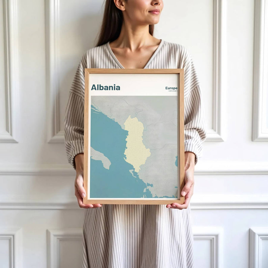 Crisp cartographic artwork showing the regional map of Albania in teal blue and cross-hatched grey with modern sans-serif country lettering. Offered by MapYourDreams, this artwork is available in flexible options including unframed paper, custom wooden frames, and gallery canvas wraps.