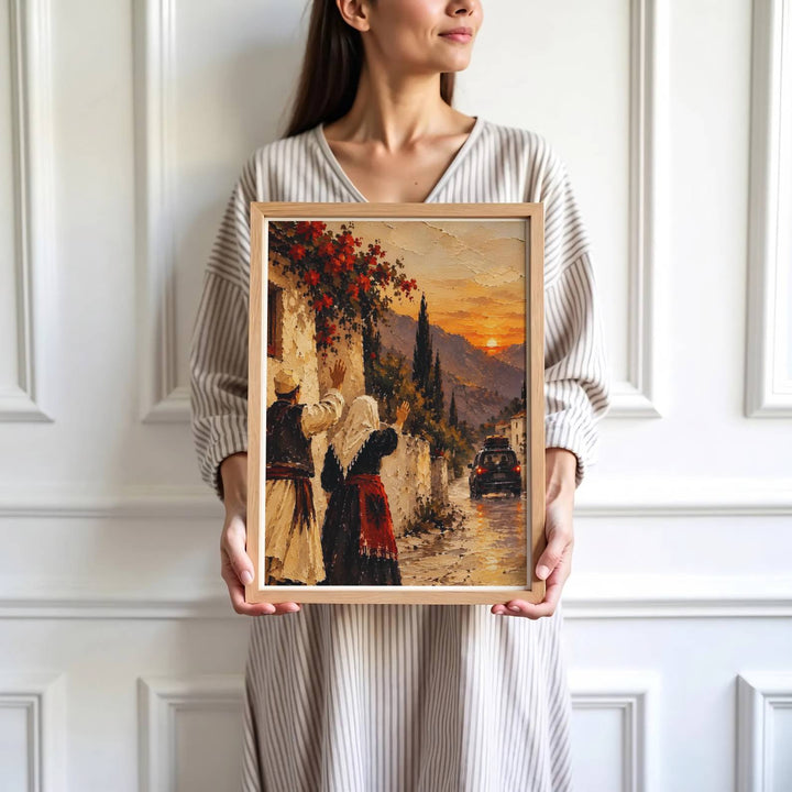 Crisp oil painterly artwork showing an Albanian couple waving farewell on a cobblestone road lined with stone houses and cypress trees. Offered by MapYourDreams, this artwork is available in flexible options including unframed paper, custom wooden frames, and gallery canvas wraps.