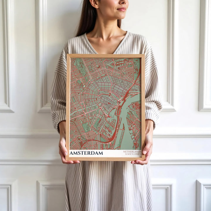 Sophisticated European cartography print of an Amsterdam street map with terracotta red lines on a sage green background, presented by MapYourDreams where customers can choose from unframed paper posters, ready-to-hang canvas, or custom framed wall decor options.
