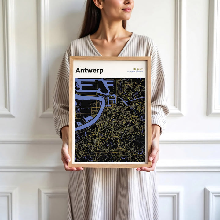 Sophisticated cartographic map art print focusing on Antwerp, Belgium, detailing the Scheldt River loop and city center in elegant dark and gold hues. Available in multiple presentation styles such as unframed paper prints, custom framed posters, and gallery stretched canvas.