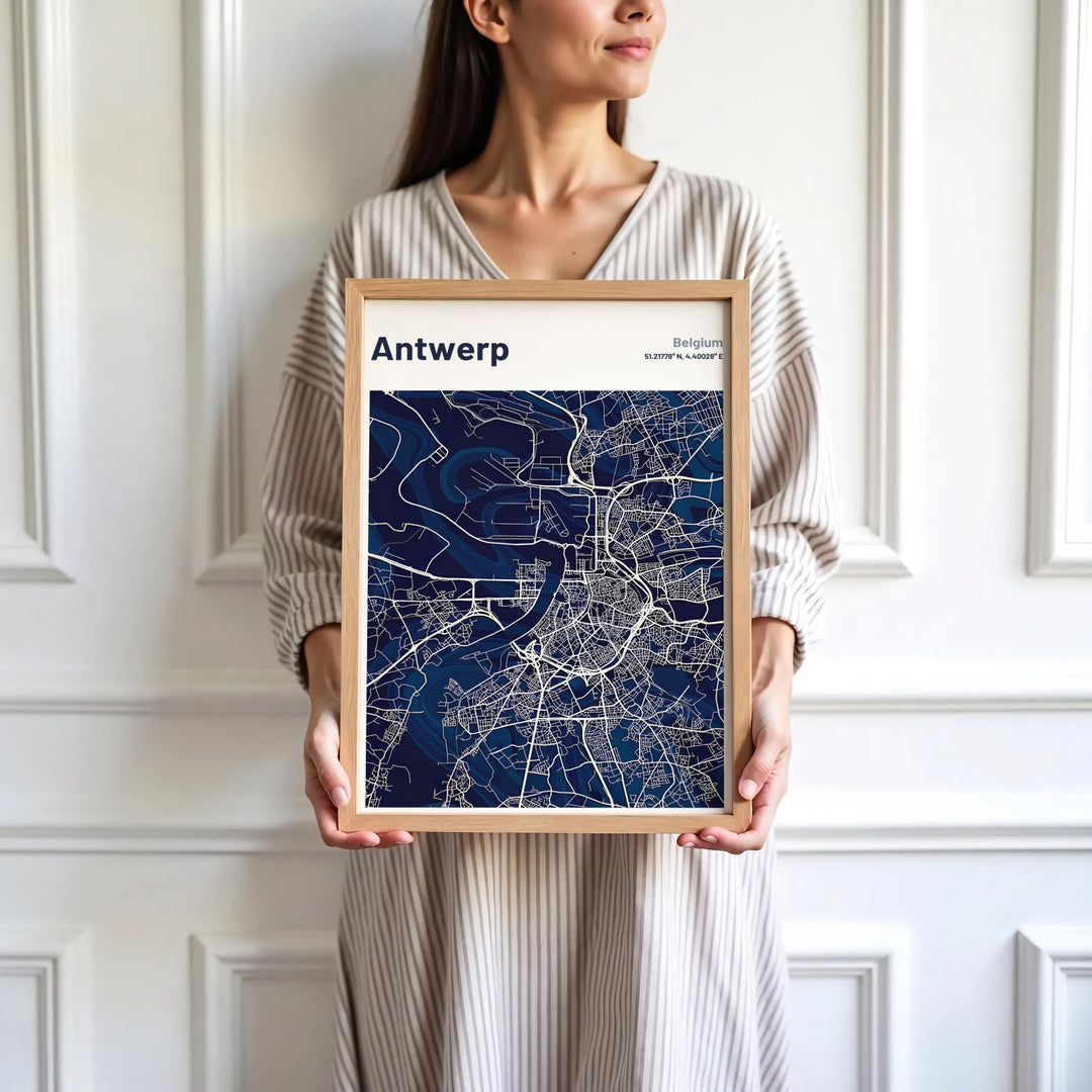 Sophisticated minimalist map print focusing on Antwerp, Belgium, detailing the Scheldt River and urban center in dark navy and white hues. Available in multiple presentation styles such as unframed paper prints, custom framed posters, and gallery stretched canvas.