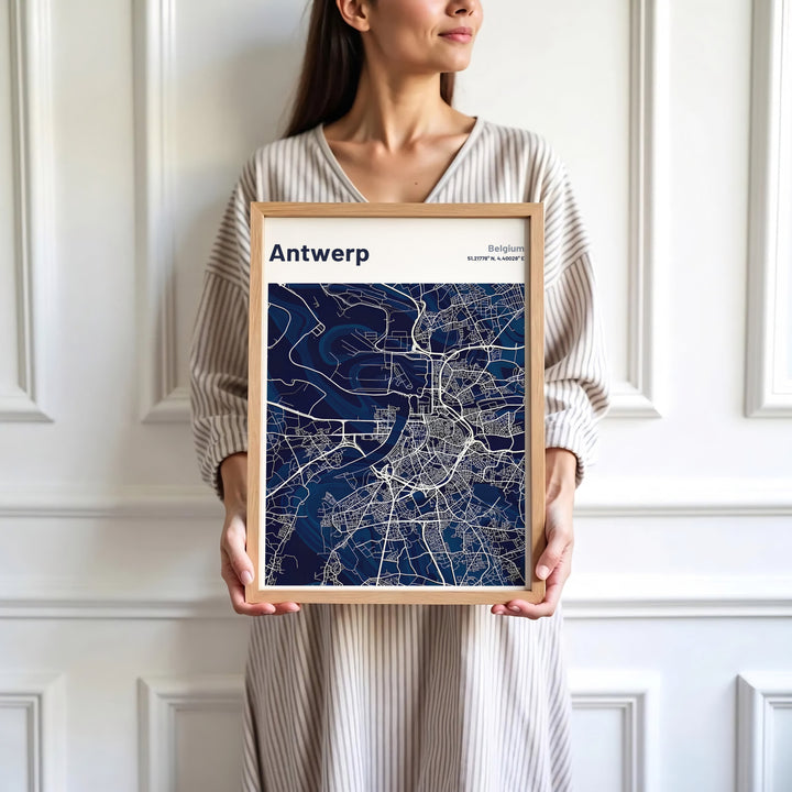 Sophisticated minimalist map print focusing on Antwerp, Belgium, detailing the Scheldt River and urban center in dark navy and white hues. Available in multiple presentation styles such as unframed paper prints, custom framed posters, and gallery stretched canvas.
