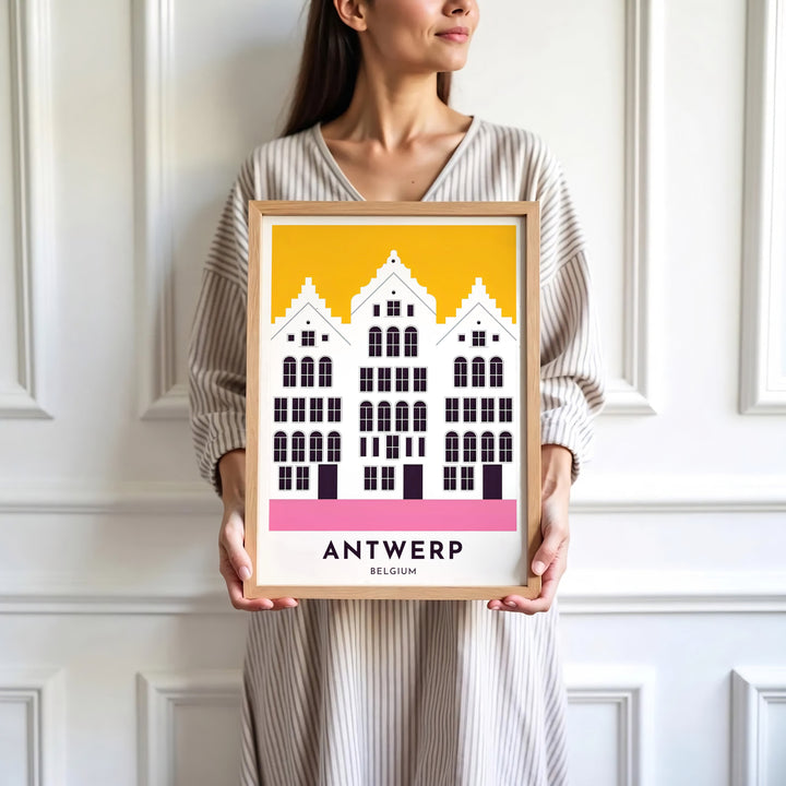 Sophisticated minimalist building print focusing on Antwerp, Belgium, detailing historic step gables in high-contrast yellow and pink hues. Available in multiple presentation styles such as unframed paper prints, custom framed posters, and gallery stretched canvas.
