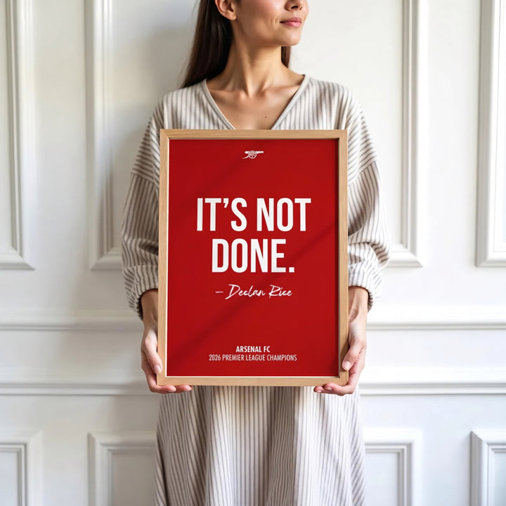 North London football victory quote print poster of Declan Rice quote set against Emirates Stadium red tone, available as unframed prints, framed options, or canvas wall decor for home interiors.