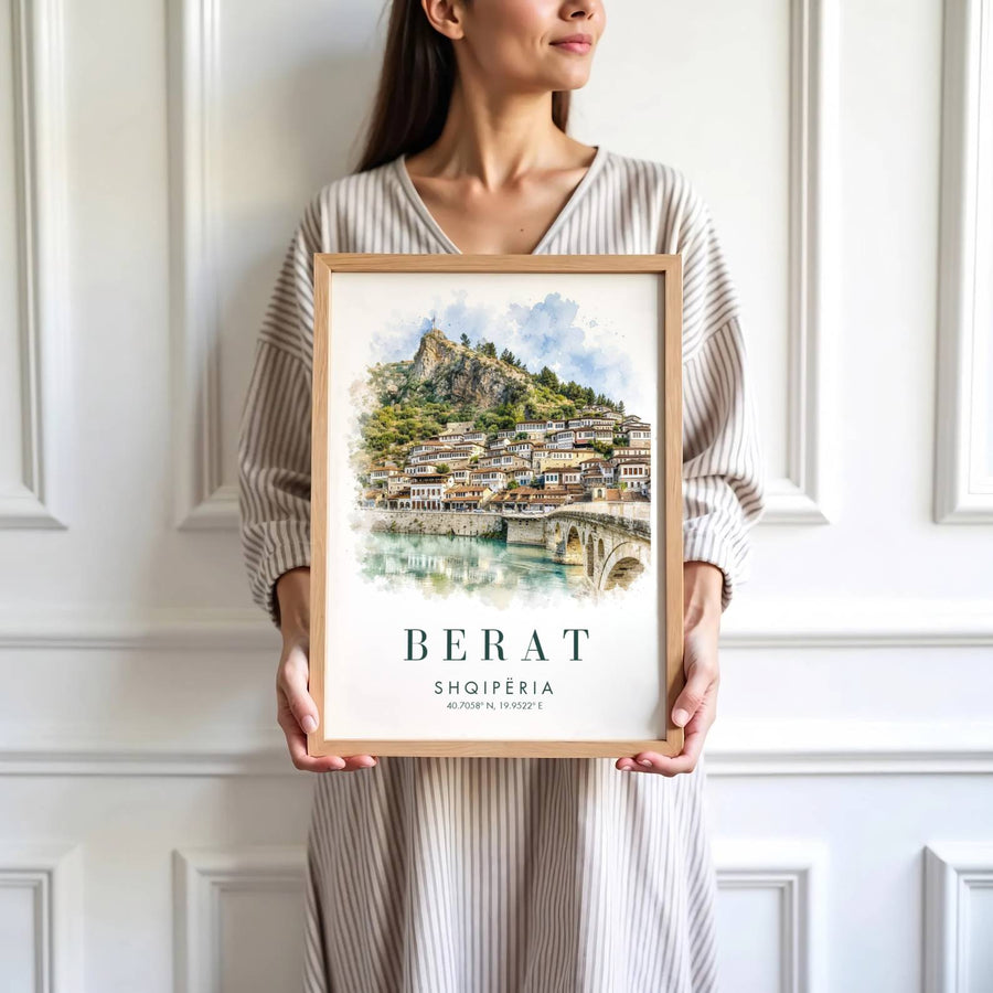 Featuring a soft watercolor painting of Berat Albania showing historic Ottoman houses and stone bridge under a blue sky, this poster elevates rooms. Offered by MapYourDreams, this artwork is available in flexible options including unframed paper, custom wooden frames, and gallery canvas wraps.
