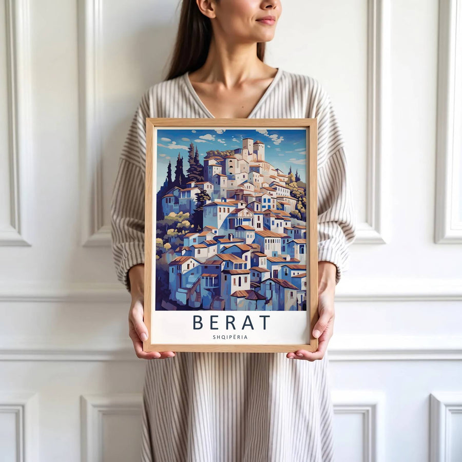 Crisp graphic artwork showing the hillside town of Berat Albania with red clay roofs, white castle watchtower, and blue sky framed with clouds behind. Offered by MapYourDreams, this artwork is available in flexible options including unframed paper, custom wooden frames, and gallery canvas wraps.