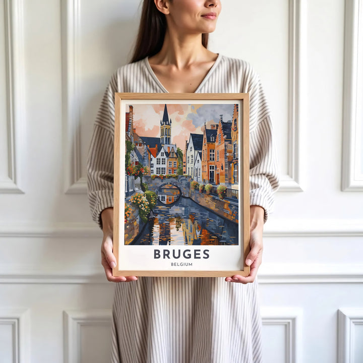 Sophisticated painted artwork focusing on Bruges, Belgium, capturing water reflections, stone arches, and medieval towers. Available in multiple presentation styles such as unframed paper prints, custom framed posters, and gallery stretched canvas.