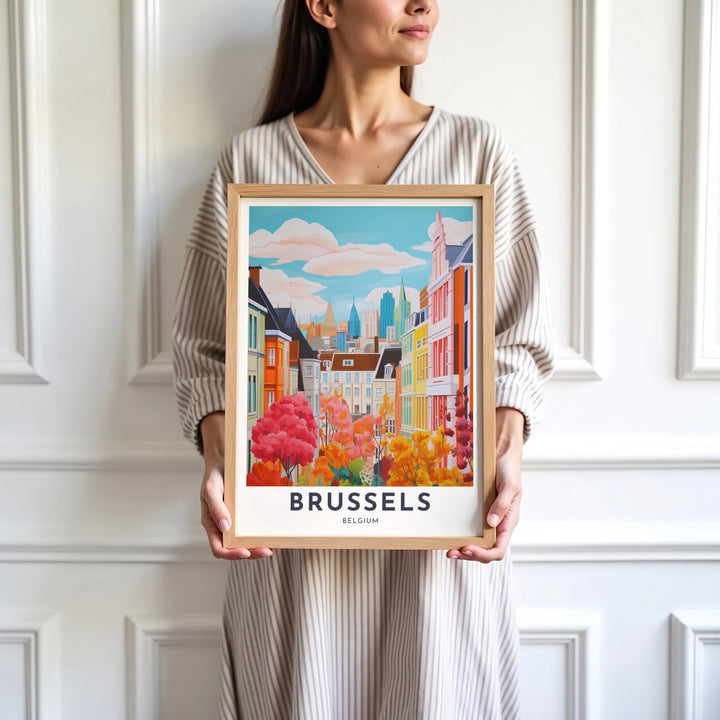 Sophisticated architectural wall art illustrating the townhouses and high-rise towers of Brussels, Belgium, surrounded by colorful autumn leaves. Available in multiple presentation styles such as unframed paper prints, custom framed posters, and gallery stretched canvas.