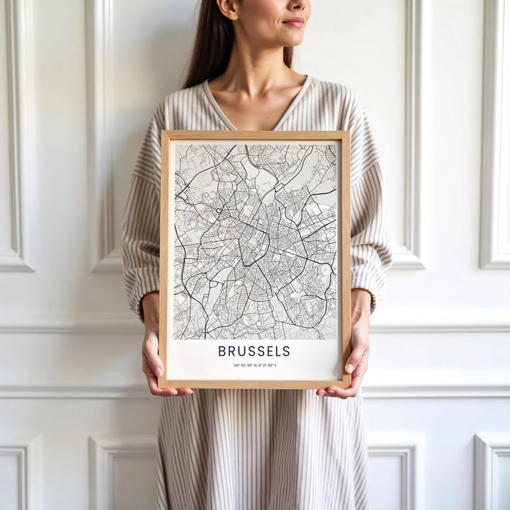 Sophisticated European map decor illustrating the street plan and monochrome aesthetic of Brussels in Belgium. Available in multiple presentation styles such as unframed paper prints, custom framed posters, and gallery stretched canvas.