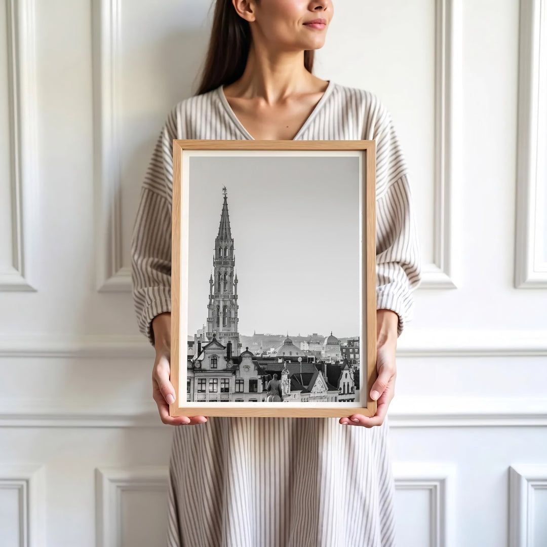Sophisticated European art decor depicting the iconic Town Hall tower and subtle sky tones in Brussels, Belgium. Available in multiple presentation styles such as unframed paper prints, custom framed posters, and gallery stretched canvas.