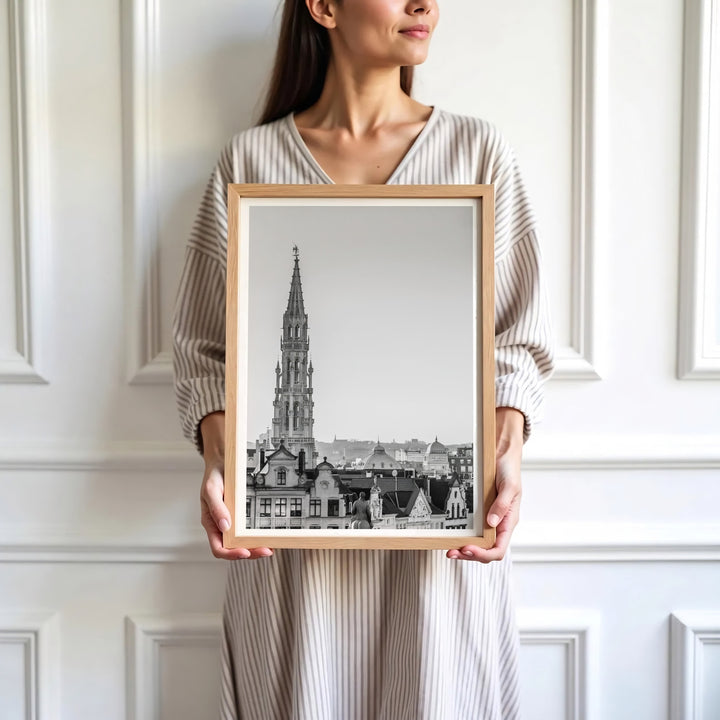 Sophisticated European art decor depicting the iconic Town Hall tower and subtle sky tones in Brussels, Belgium. Available in multiple presentation styles such as unframed paper prints, custom framed posters, and gallery stretched canvas.