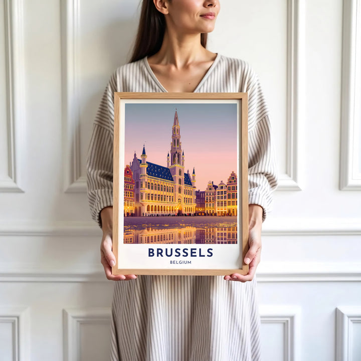 Sophisticated European city decor illustrating the sunset hues and Brabantine Gothic tower of Brussels, Belgium. Available in multiple presentation styles such as unframed paper prints, custom framed posters, and gallery stretched canvas.