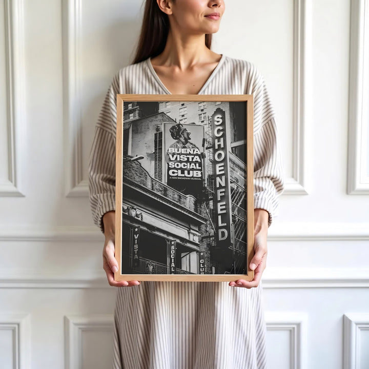Contemporary monochrome urban photograph of the Gerald Schoenfeld Theatre facade on West 45th Street hosting Buena Vista Social Club on Broadway, presented by MapYourDreams where customers can choose from unframed paper posters, ready-to-hang canvas decor, or custom framed wall art choices.