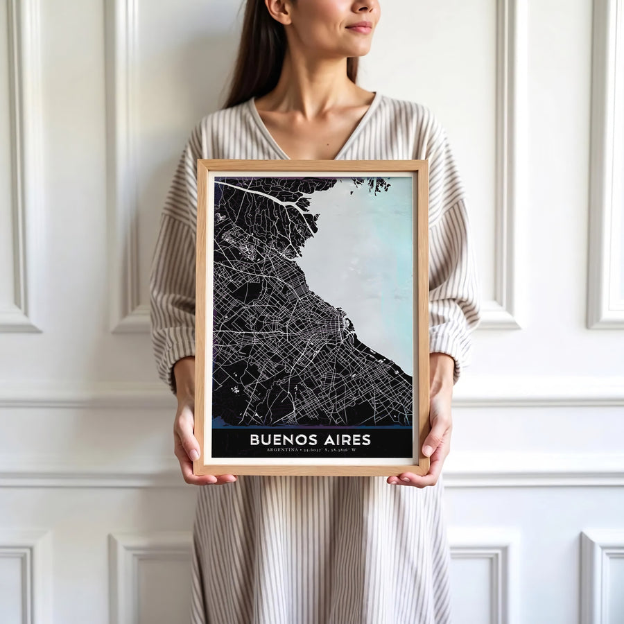 Modern cartographic wall art of Buenos Aires combining deep black landmass, white roads, and icy blue water features. Skillfully produced by MapYourDreams, this artwork is provided in multiple formats including unframed paper stock, custom frames, or stretched canvas wraps.