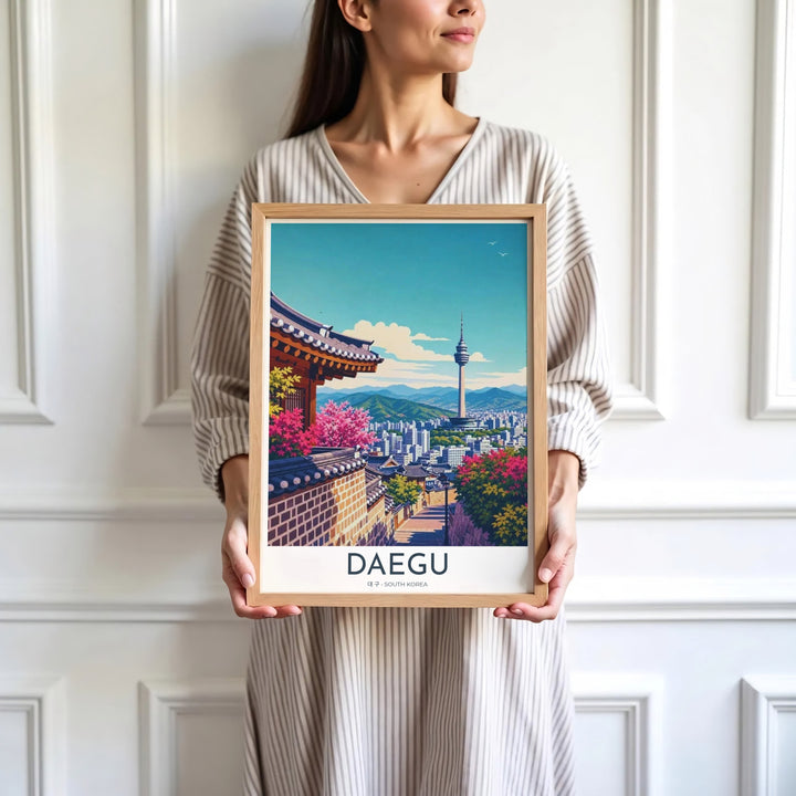 Minimalist white-bordered travel print of Daegu, South Korea, showcasing a scenic vista of 83 Tower and traditional Hanok courtyard walls under a sunlit sky. Offered by MapYourDreams, this artwork is available in flexible options including unframed paper, custom wooden frames, and gallery canvas wraps.
