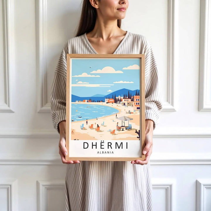 Crisp graphic artwork showing the beach of Dhërmi Albania with parasols, sun loungers, blue sea, and distant mountains framed by clear sky. Offered by MapYourDreams, this artwork is available in flexible options including unframed paper, custom wooden frames, and gallery canvas wraps.