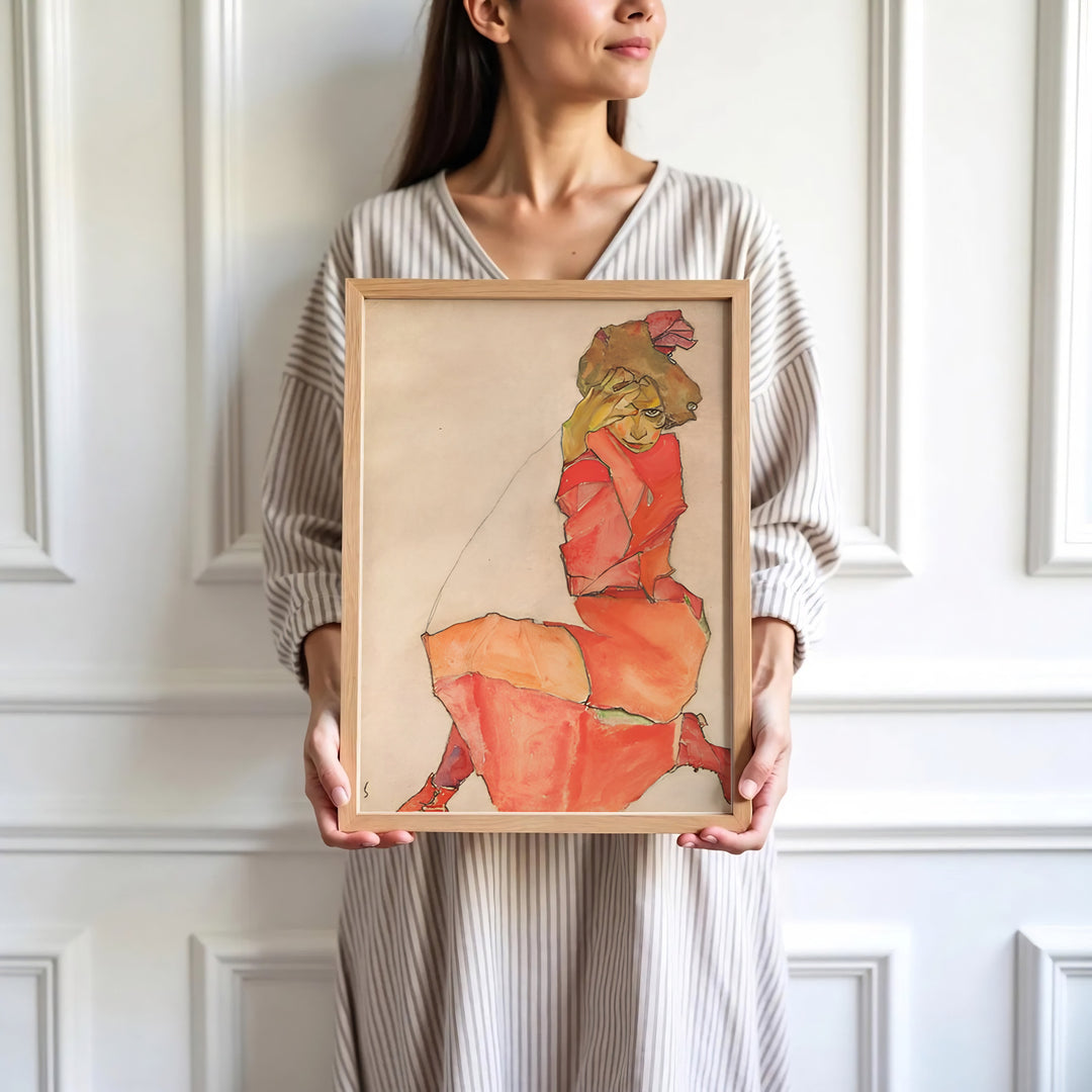 High-definition museum watercolor print of Egon Schiele Kneeling Female In Orange Red Dress 1910 at Leopold Museum Vienna displaying refined graphic draughtsmanship style. Order custom framed wall art, unframed poster prints, and stretched gallery canvas formats directly at MapYourDreams store for wall transformations.