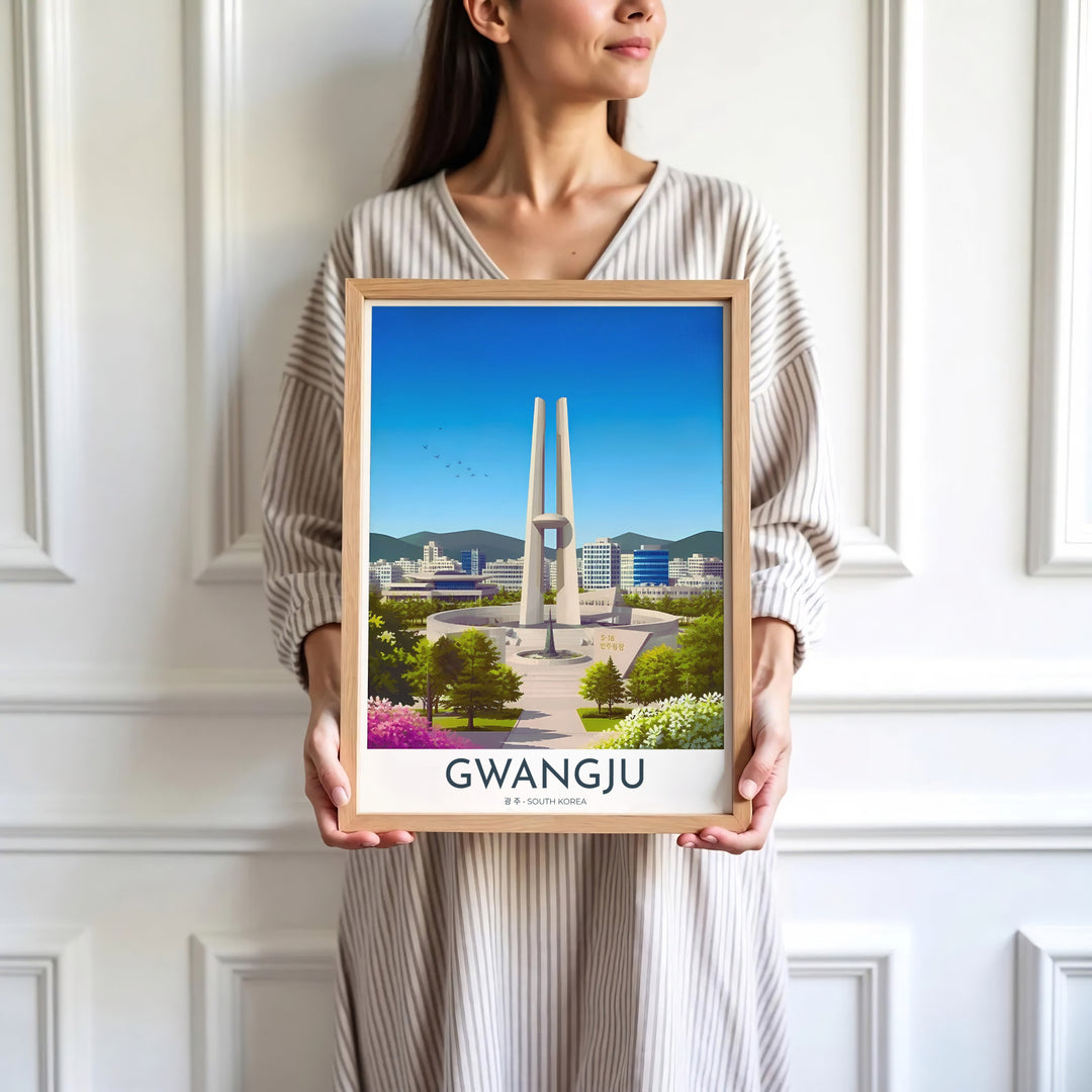 Minimalist white-bordered travel print featuring the May 18 Memorial Tower in Gwangju, South Korea, framed by blooming spring flowers and soft green foliage. Offered by MapYourDreams, this artwork is available in flexible options including unframed paper, custom wooden frames, and gallery canvas wraps.
