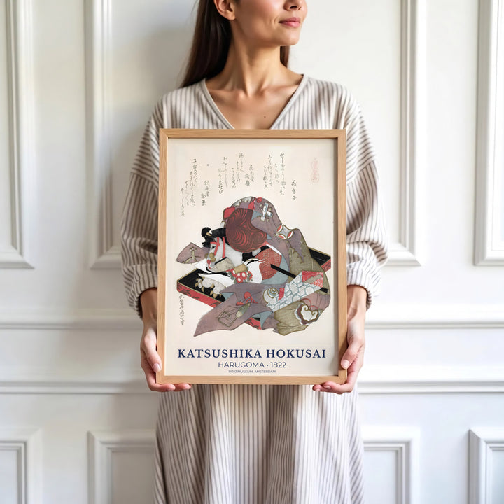Soft cream background vintage Japanese wall art by artist Katsushika Hokusai showing traditional poetry and a hobby horse in Amsterdam. Browse archival framed, unframed, and canvas poster choices at MapYourDreams.