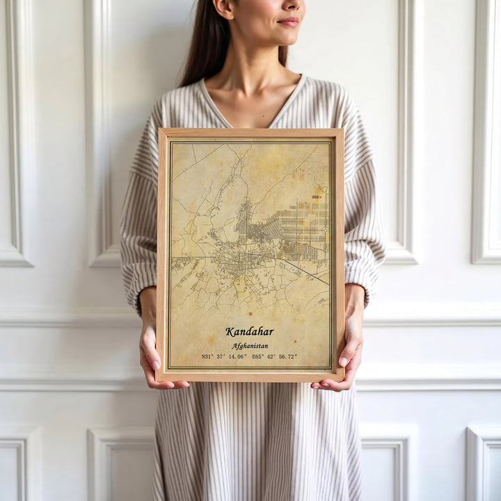 Travel destination map poster depicting the city streets and geographical markers of Kandahar, Afghanistan, bordered by classic cartographic lines. Presented by MapYourDreams as an unframed paper print, a gallery canvas, or a custom framed decor piece in black, natural wood, and white frames for studio spaces.
