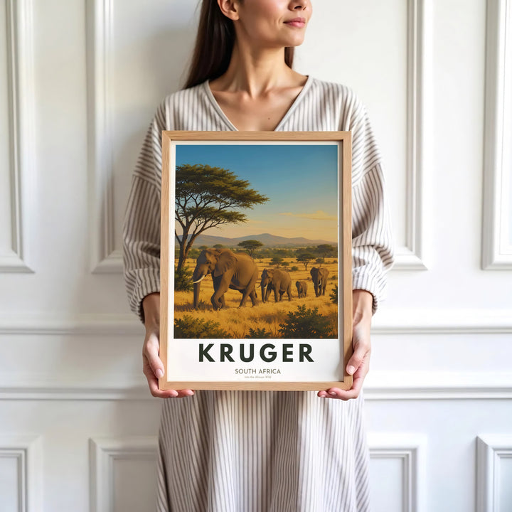 Elegant Kruger South Africa safari art print capturing a herd of elephants wandering across sun-drenched savannas. Offered by MapYourDreams, this artwork is available in flexible options including unframed paper, custom wooden frames, and gallery canvas choices for your living area.