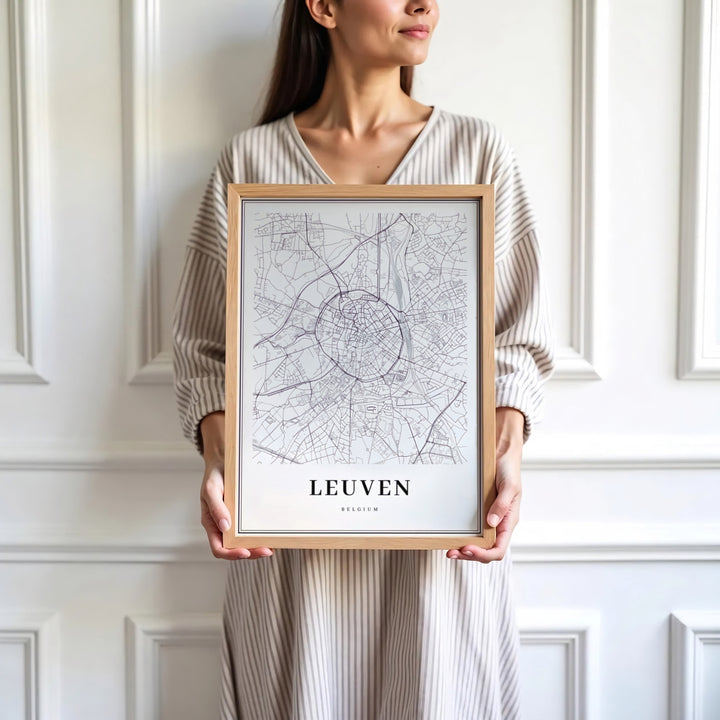 Sophisticated Scandinavian cartography wall decor displaying classical typography and roads for Leuven, Belgium. Available in multiple presentation styles such as unframed paper prints, custom framed posters, and gallery stretched canvas.