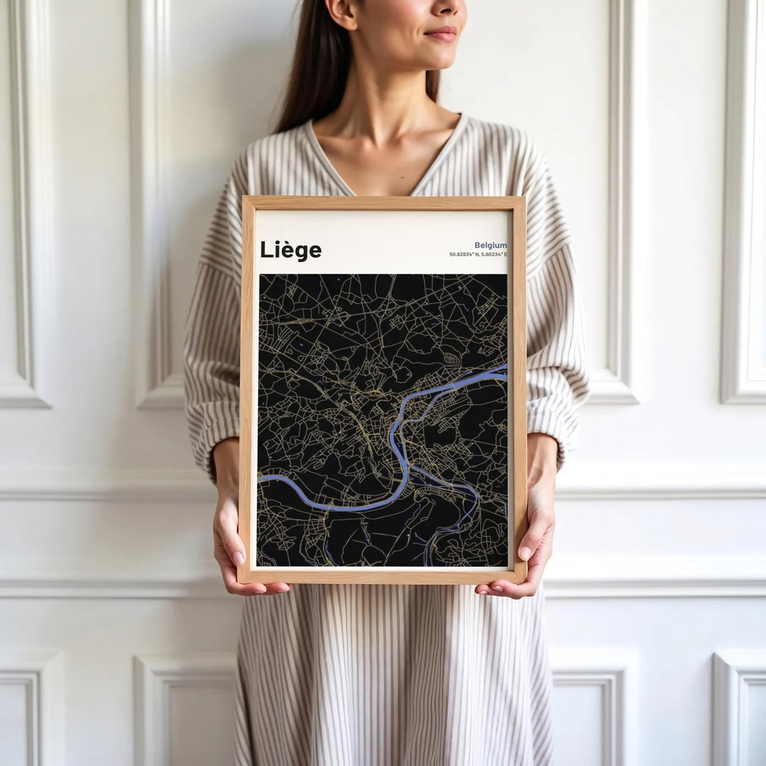 Sophisticated black and gold cartography wall decor displaying coordinates and roads for Liège, Belgium. Available in multiple presentation styles such as unframed paper prints, custom framed posters, and gallery stretched canvas.