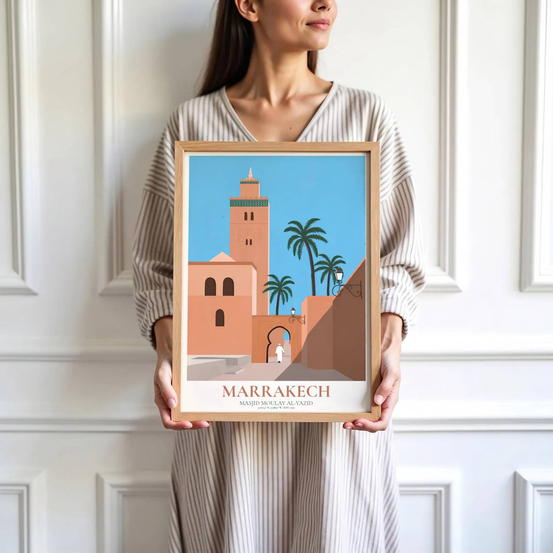 High detail graphic print depicting Kasbah Mosque minaret, arched gateway, clay walls, and palm trees in Marrakech Morocco. Brought by MapYourDreams, this artwork is available in flexible options including unframed paper, custom wooden frames, and gallery canvas wraps for study room decor.