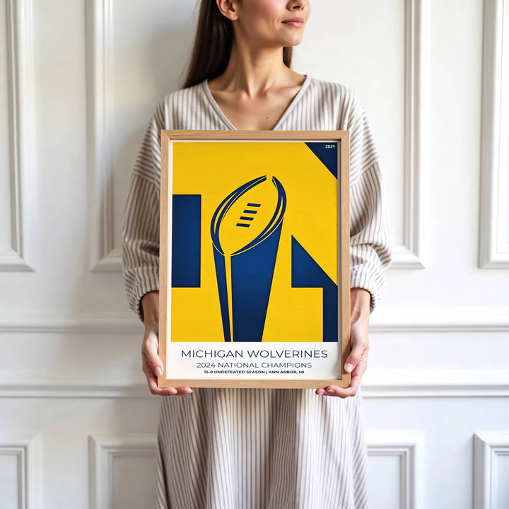 High detail graphic print depicting Michigan Wolverines national trophy silhouette, 15-0 record, and Maize yellow geometry. Brought by MapYourDreams, this artwork is available in flexible options including unframed paper, custom wooden frames, and gallery canvas wraps for study room decor.