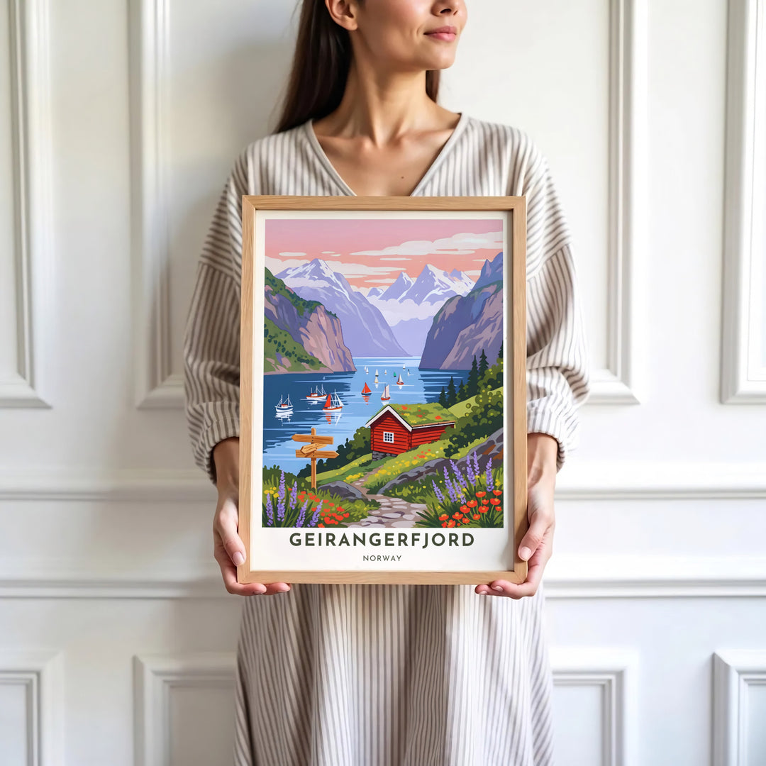 Scenic poster of Geirangerfjord in Norway with a classic red wooden house overlooking serene waters filled with sailboats at sunset. Offered by MapYourDreams, this travel artwork is customizable as an unframed poster print, ready-to-display framed print, or premium gallery wrap canvas.