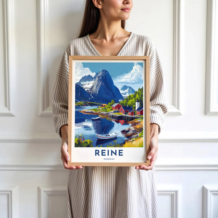 Alpine landscape poster of Reine Norway featuring red rorbuer houses along a tranquil bay backed by dramatic rock summits. Decorate your walls with options ranging from simple unframed poster paper to sturdy custom wood frames and stretched canvas wall displays.