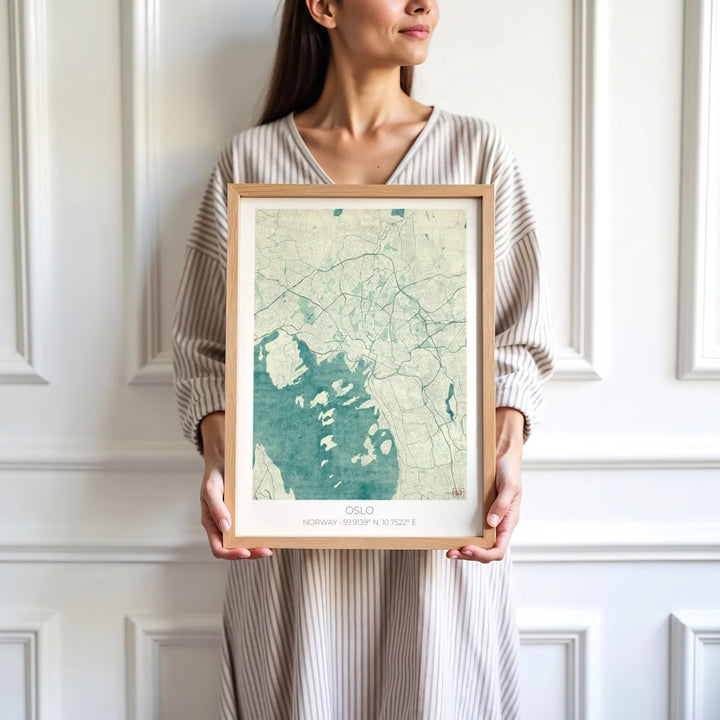 Vintage cartographic vector print showing the complete urban grid and Oslofjord coastline of Oslo Norway with centered coordinate details. Designed for home decor, select between lightweight unframed paper prints, solid wood display frames, or gallery wrapped canvas panels.