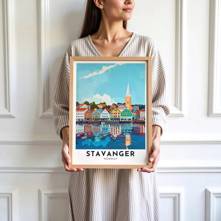 Scenic travel artwork displaying the Stavanger Norway skyline with bold city typography across a vibrant waterfront reflection. Designed for home decor, select between lightweight unframed paper prints, solid wood display frames, or gallery wrapped canvas panels.