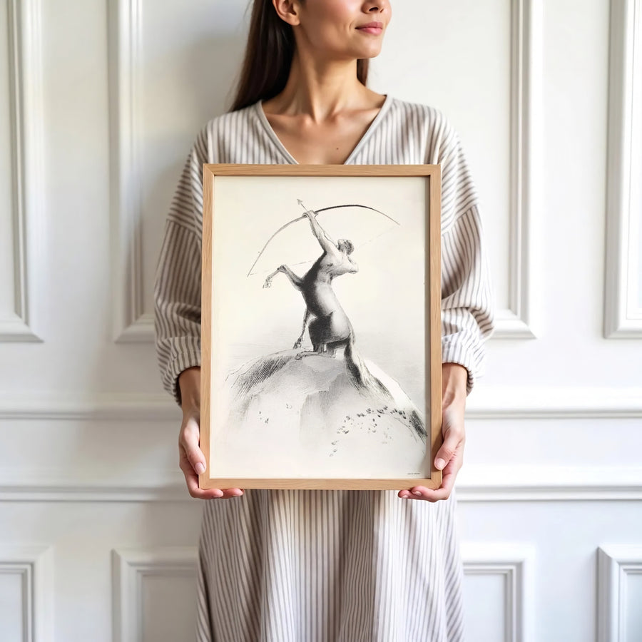 Subtle 1895 pencil-style lithograph Centaur Aiming At The Clouds by Odilon Redon, capturing vintage mythic drama. Elevate your home interior with options ranging from unframed paper prints to custom glass framing and gallery canvas wraps by MapYourDreams.