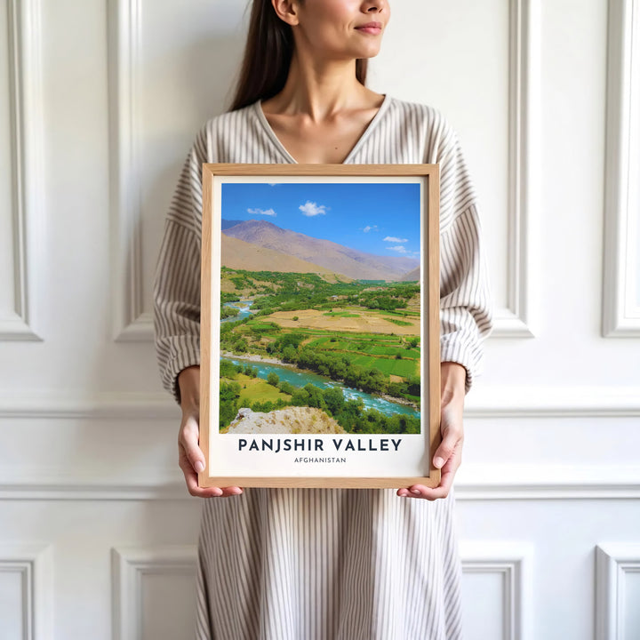 Travel destination photography poster depicting Panjshir Valley, Afghanistan, framed by steep mountain slopes and brilliant blue sky. Presented by MapYourDreams as an unframed paper print, a gallery canvas, or a custom framed decor piece in black, natural wood, and white frames for creative studio spaces.