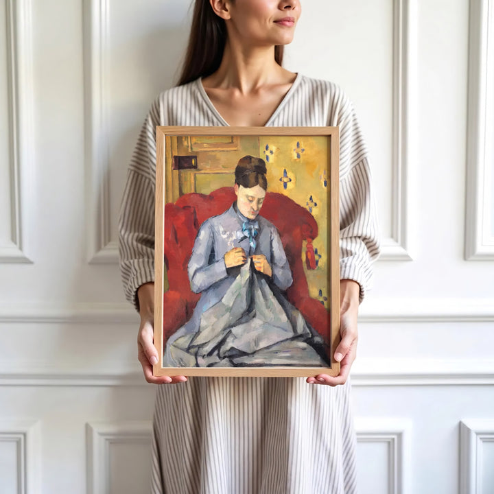 High-definition European portrait print of Paul Cezanne Madame Cezanne Sewing 1877 portraying a seated seamstress in Paris France. Order custom framed wall art, unframed poster prints, and stretched gallery canvas formats directly at MapYourDreams.