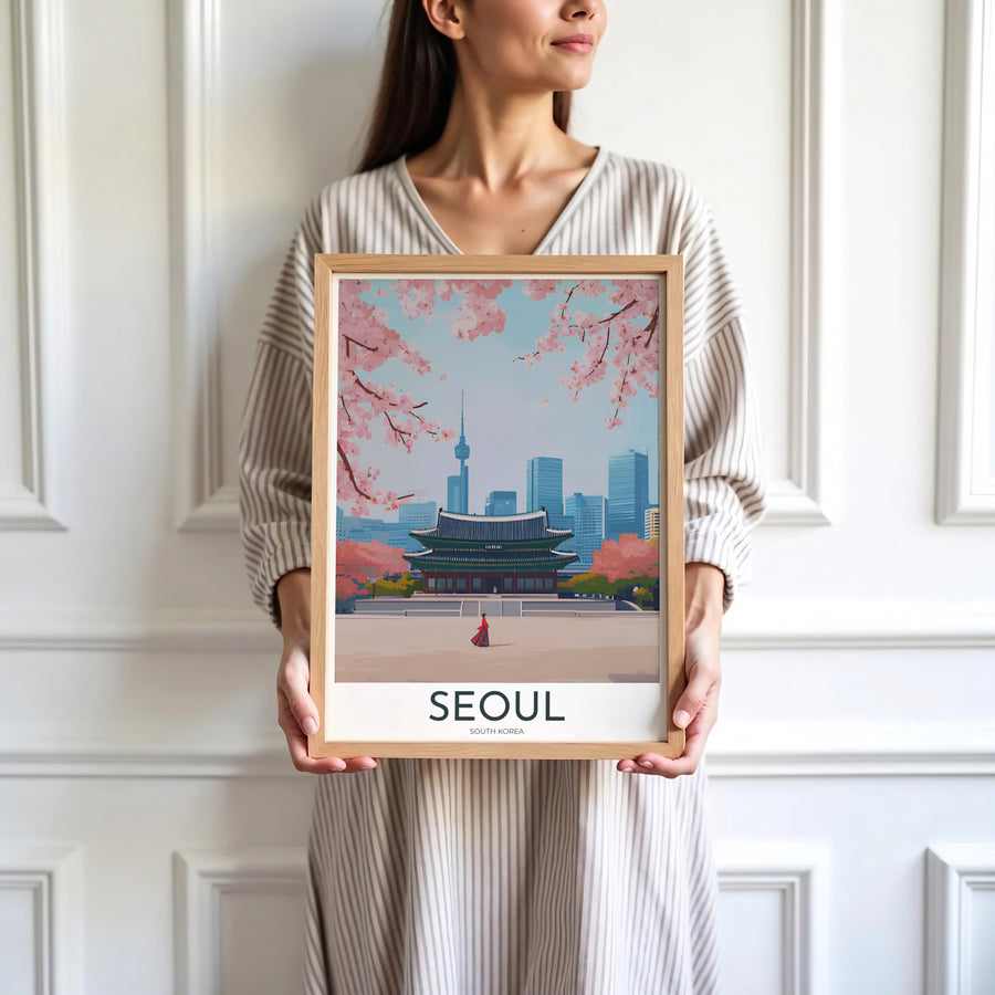 Minimalist white-bordered travel print of Gyeongbokgung Palace in Seoul, South Korea, highlighting traditional wooden architecture, red Hanbok garments, and N Seoul Tower in spring. Offered by MapYourDreams, this artwork is available in flexible options including unframed paper, custom wooden frames, and gallery canvas wraps.