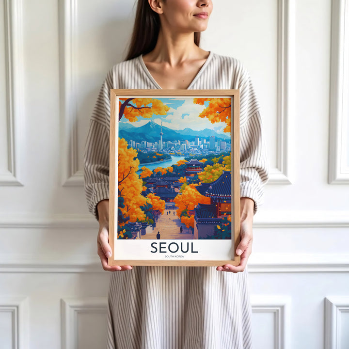 Minimalist white-bordered travel print of Seoul, South Korea, highlighting traditional Korean wooden gates, golden autumn foliage, the Han River, and N Seoul Tower. Offered by MapYourDreams, this artwork is available in flexible options including unframed paper, custom wooden frames, and gallery canvas wraps.