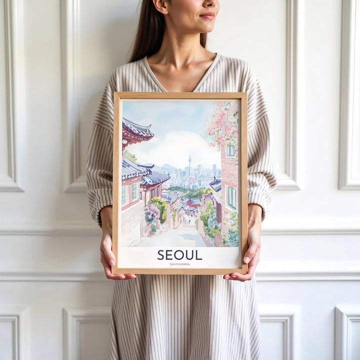 Minimalist white-bordered travel print of Seoul, South Korea, highlighting traditional Korean wooden lattice windows, spring cherry blossoms, and N Seoul Tower in soft watercolor tones. Offered by MapYourDreams, this artwork is available in flexible options including unframed paper, custom wooden frames, and gallery canvas wraps.