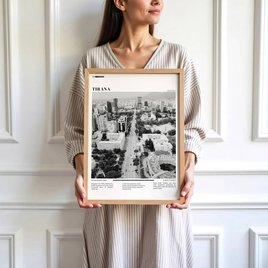 Vibrant urban geometry and contemporary architectural developments define the bustling heart of Tirana along Dëshmorët e Kombit Boulevard through atmospheric Black &amp; White photography. MapYourDreams produces this image in unframed paper, custom wooden frames, and stretched canvas options.