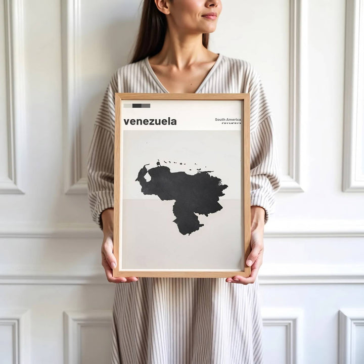 Saturated black ink map print showing the country shape and national coordinates of Venezuela on warm greige paper. Skillfully produced by MapYourDreams, this artwork is provided in multiple formats including unframed paper stock, custom frames, or stretched canvas wraps.