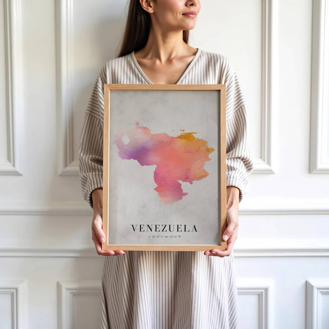Saturated dusty rose and grey travel print showing the watercolor country shape and national coordinates of Venezuela. Skillfully produced by MapYourDreams, this artwork is provided in multiple formats including unframed paper stock, custom frames, or stretched canvas wraps.