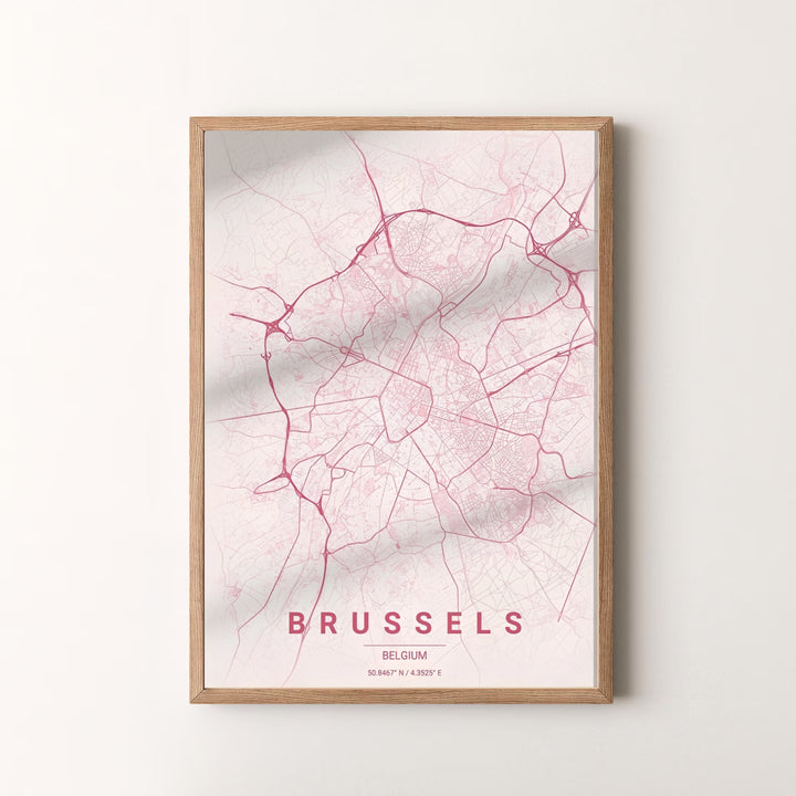A lovely cartography print capturing the detailed street layout of Brussels, Belgium, set against a delicate blush pink background. Offered by MapYourDreams, this artwork is available in flexible options including unframed paper, custom wooden frames, and gallery canvas wraps.