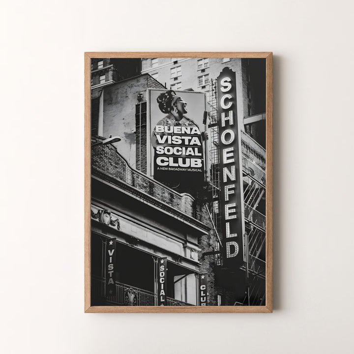 Bold black and white Manhattan landmark art piece detailing the vertical marquee, brick masonry, and street banners at the Gerald Schoenfeld Theatre, available at MapYourDreams as an unframed print, a stretched canvas, or custom framing options to complement statement gallery wall setups.