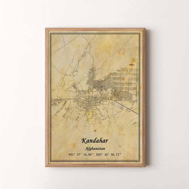 Urban map illustration print of Kandahar, Afghanistan, highlighting historical street networks and precise coordinate details on aged parchment media. Offered by MapYourDreams as an unframed art print, a gallery canvas print, or a custom framed wall art piece in retro white and silver frame choices.